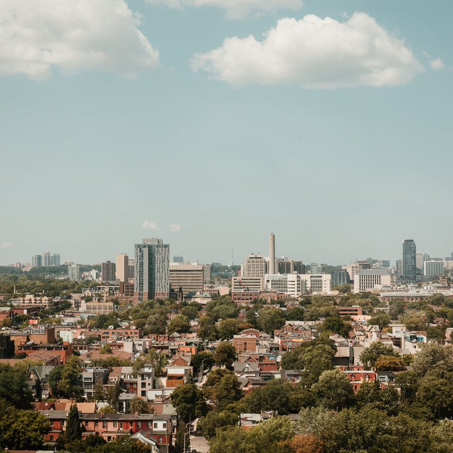 A city skyline above low-rise residential streets